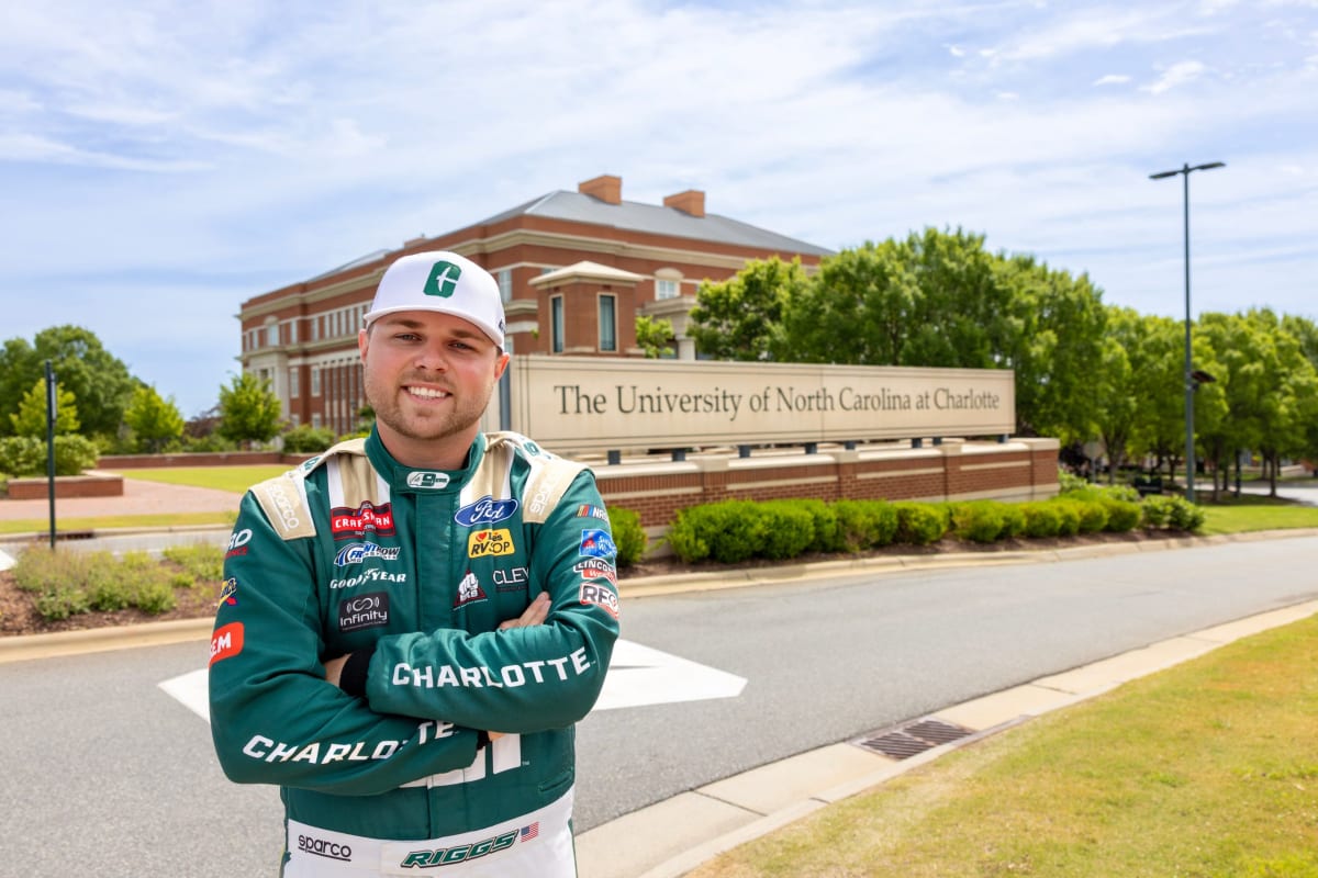 ** NASCAR Truck Series driver Layne Riggs celebrating championship victory on racetrack