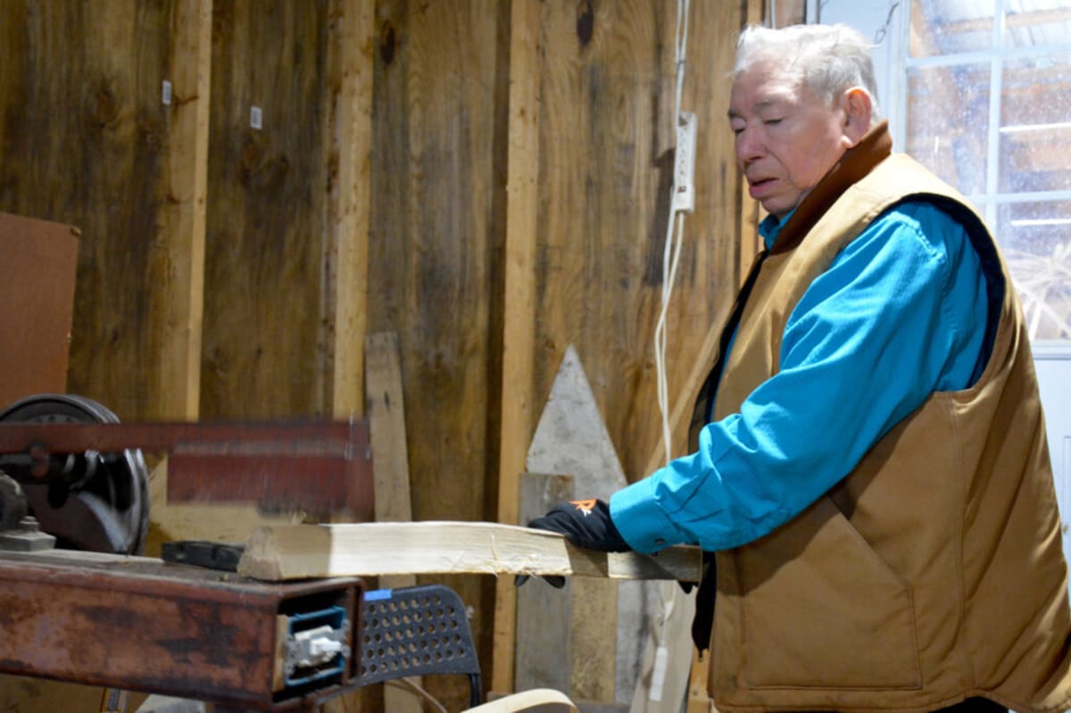 Master basketmaker Richard Silliboy holds ash wood splints in his Maine workshop