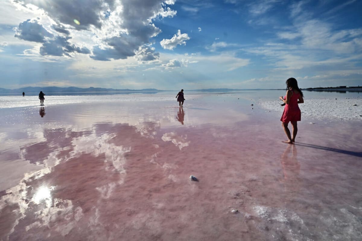 ** Aerial view of Great Salt Lake showing shallow waters and exposed lakebed in Utah landscape