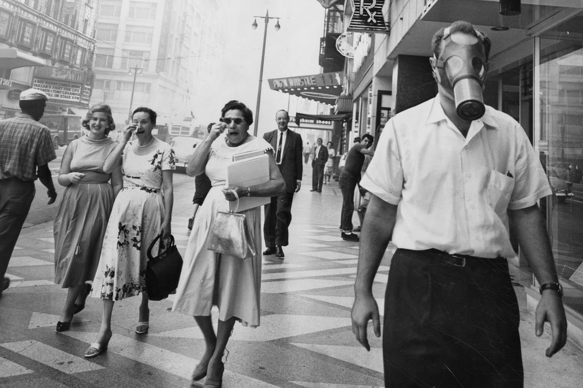 Ann Carlson holding her book Smog and Sunshine about Los Angeles air quality transformation