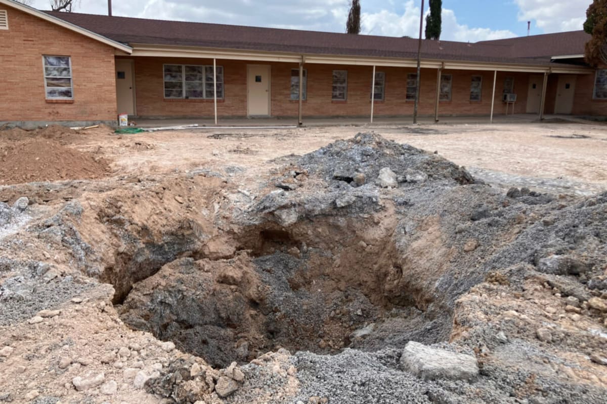 ** Pastor David Tucker stands outside First Baptist Church of Grandfalls, Texas where leak was contained