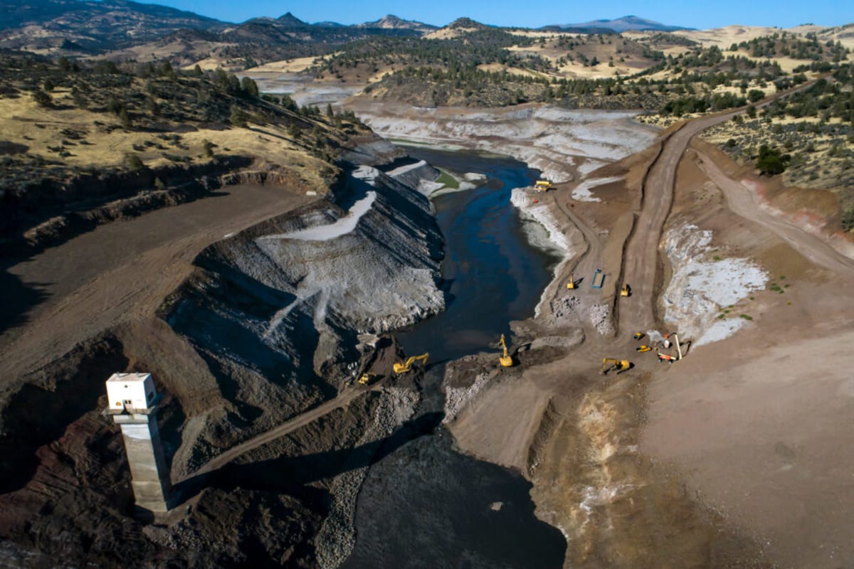 ** Before and after photos showing Klamath River flowing freely where Copco Dam once stood