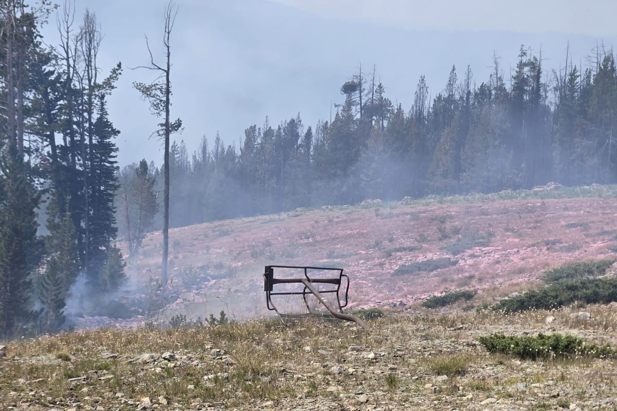 Red flames from Sand Creek Fire illuminating Maverick Mountain ski area at night