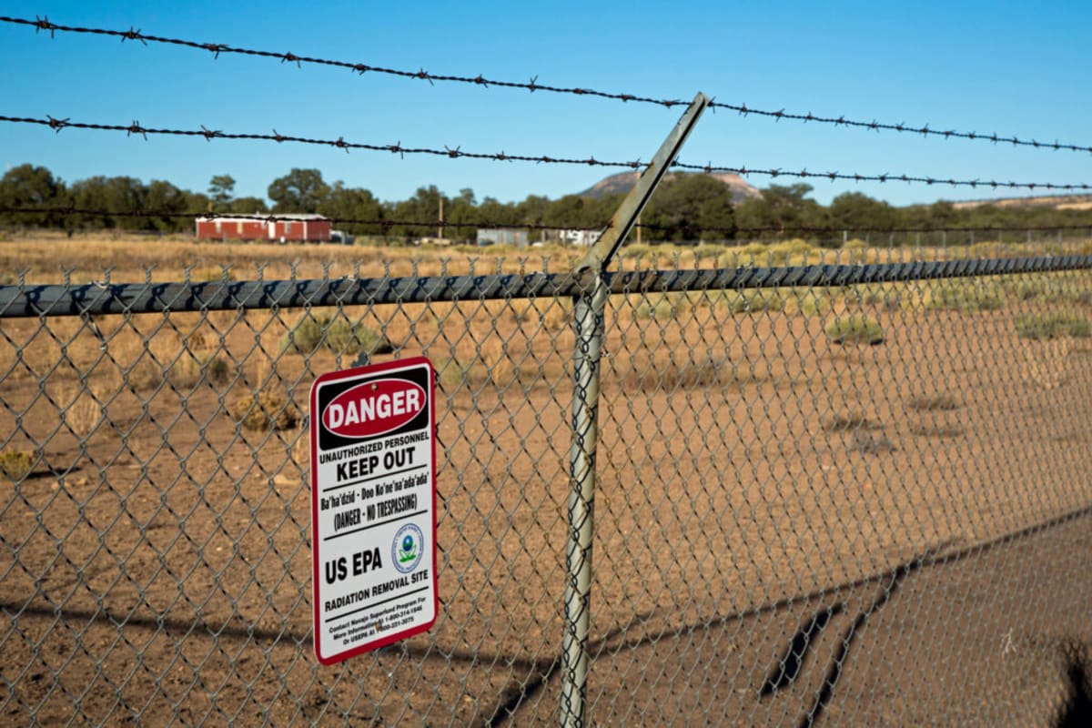 New Mexico landscape with abandoned uranium mine shaft, symbolic of state's mining legacy and environmental protection