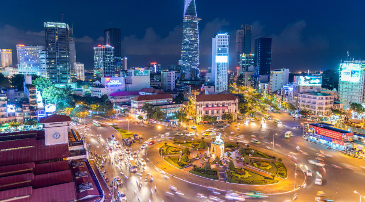 Bustling Vietnamese street market filled with tourists shopping during Lunar New Year celebrations
