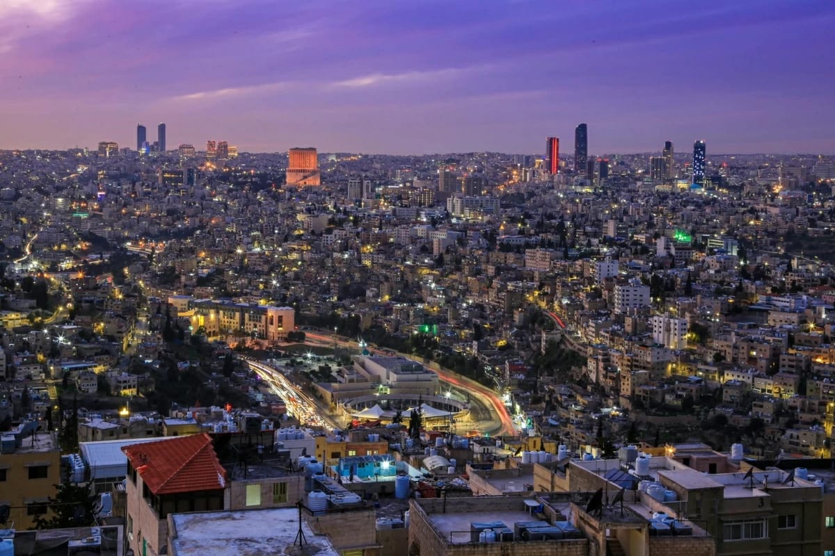 Jordanian women working in modern office setting celebrating employment growth and economic progress