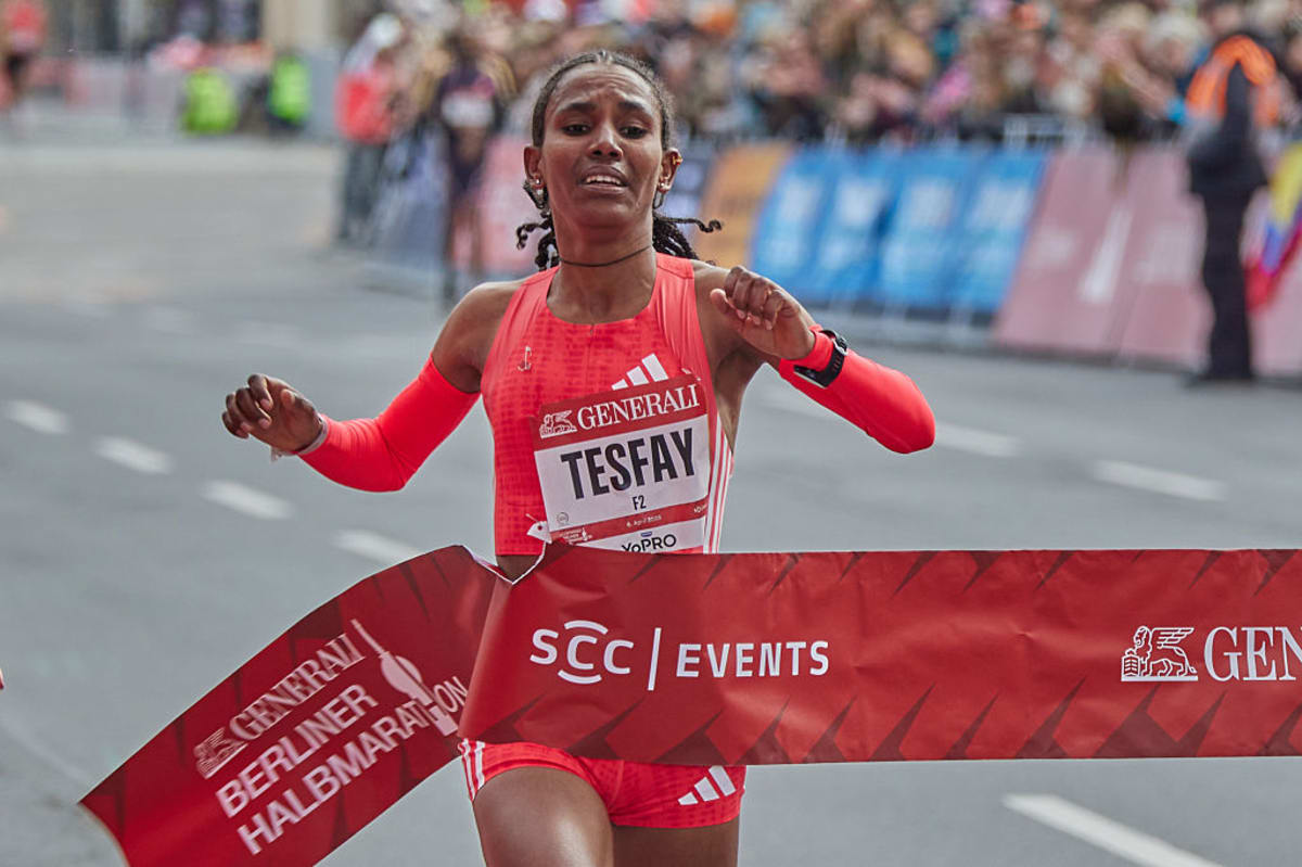 Ethiopian runner Fotyen Tesfay competing in marathon race wearing racing gear