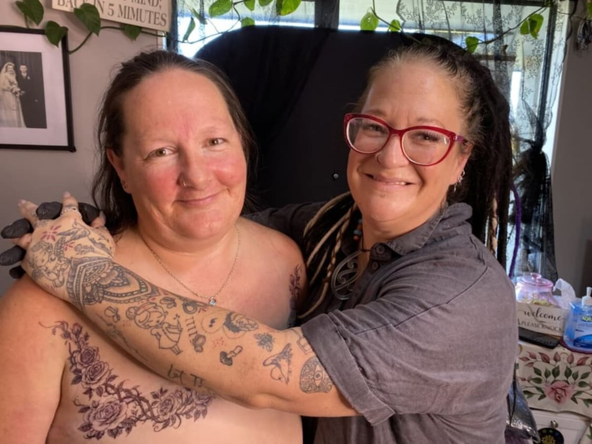Tattoo artist Stace Donaldson creating mastectomy scar cover up artwork for breast cancer survivor