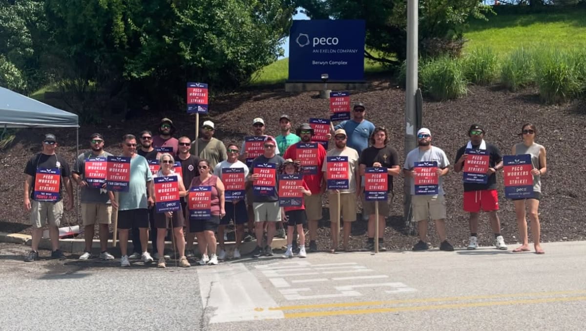 PECO utility workers celebrating together after winning historic first strike in company history