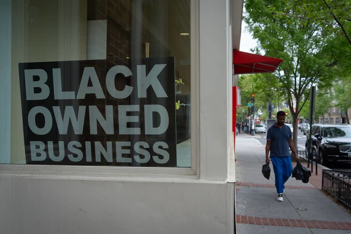Black business owners working together in modern retail or office space, creating community opportunities