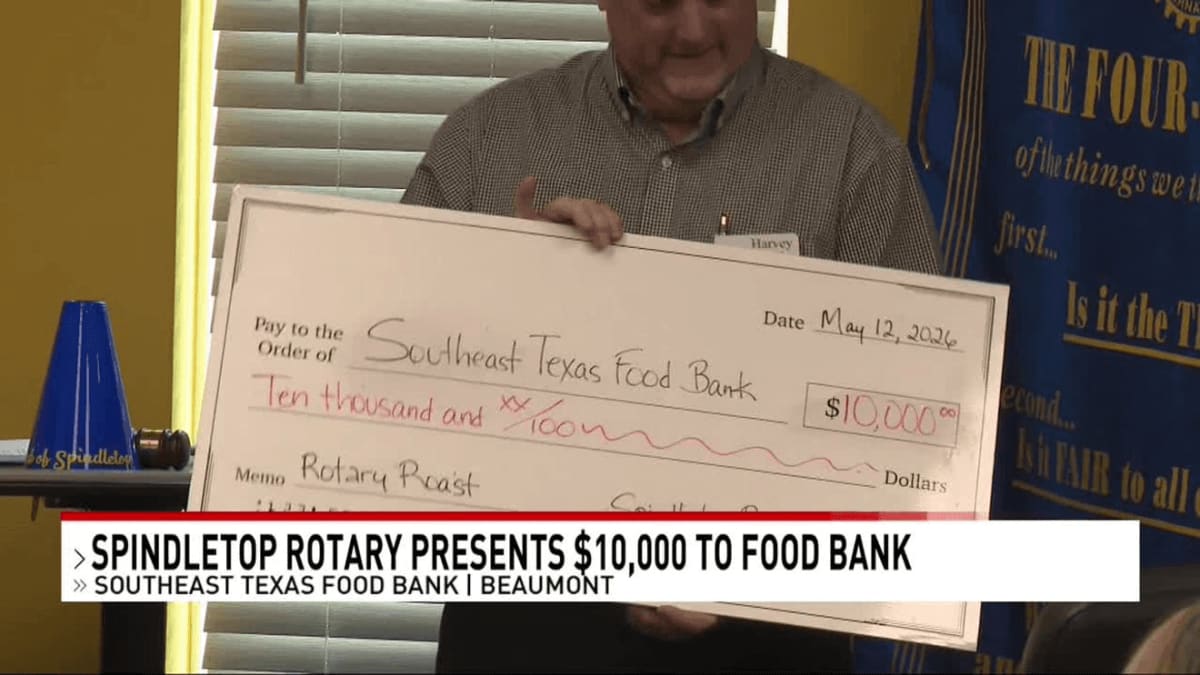 Spindletop Rotary Club members presenting oversized check to Southeast Texas Food Bank representatives