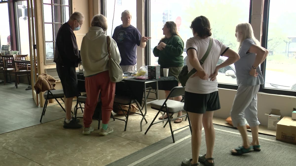 ** Volunteers organizing relief supplies inside Minnesota theater converted to wildfire help center