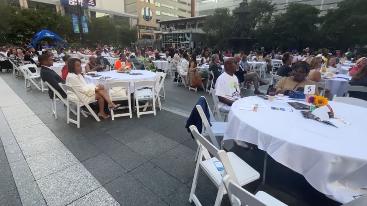 ** Families of diverse backgrounds gather at Cincinnati's Sawyer Point for annual reunion celebration