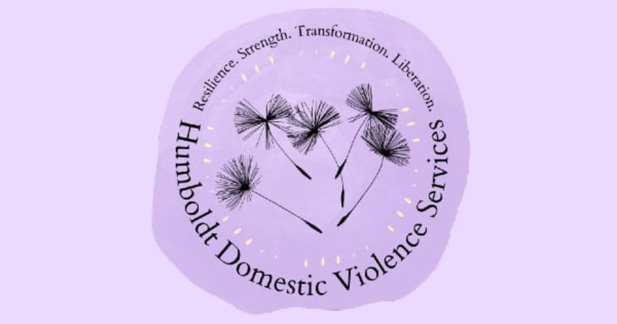 Crowded community hall filled with people playing bingo to support domestic violence survivors