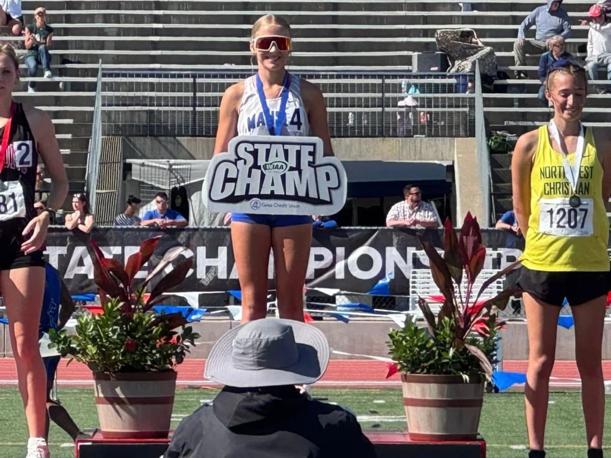 Freshman runner Grace Walsh competing in distance race at Washington state track championship