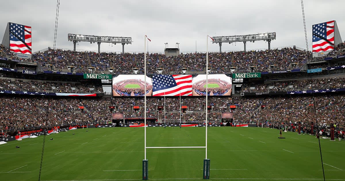 Packed M&T Bank Stadium filled with rugby fans wearing green jerseys during historic match