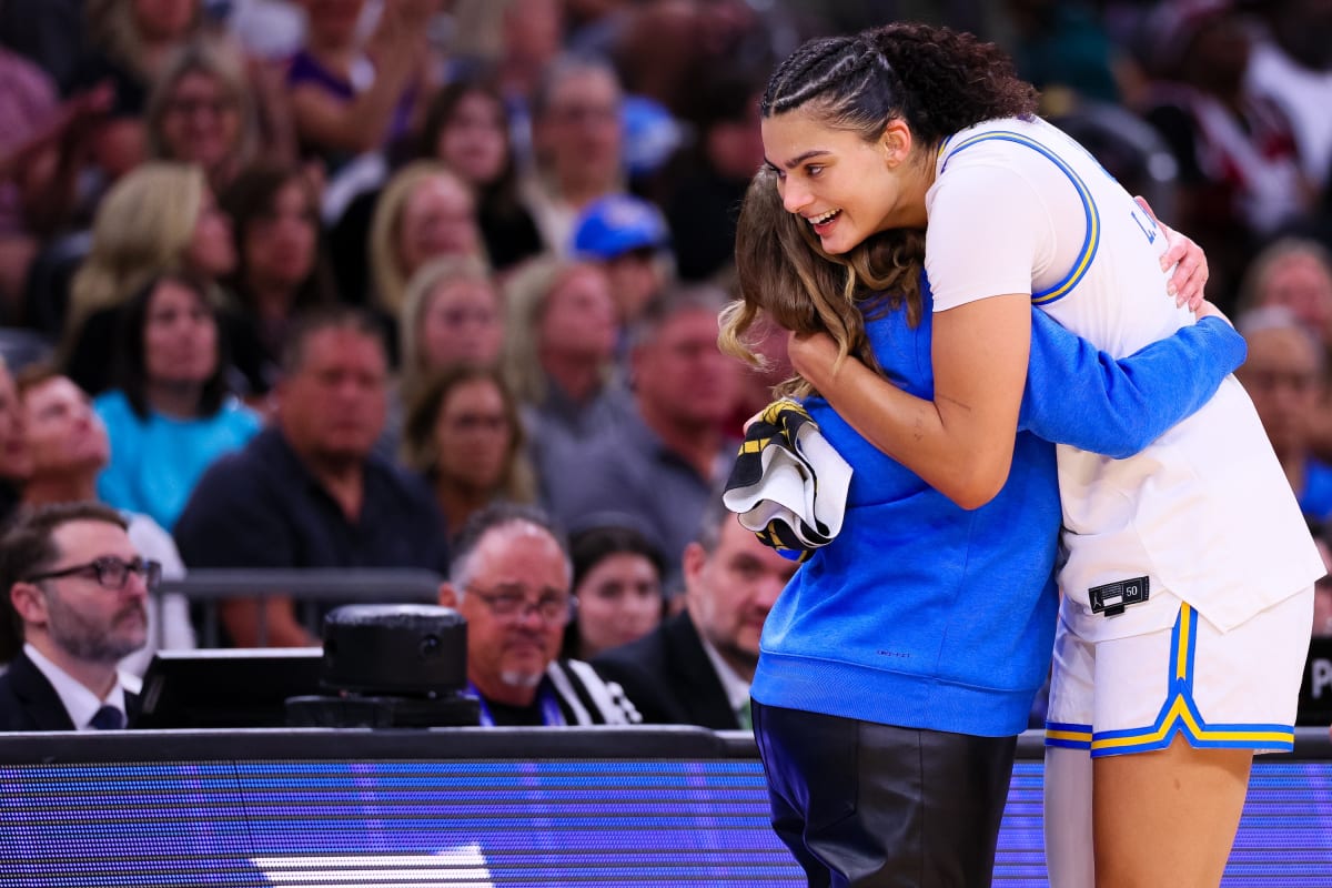 UCLA women's basketball team celebrating with national championship trophy after defeating South Carolina