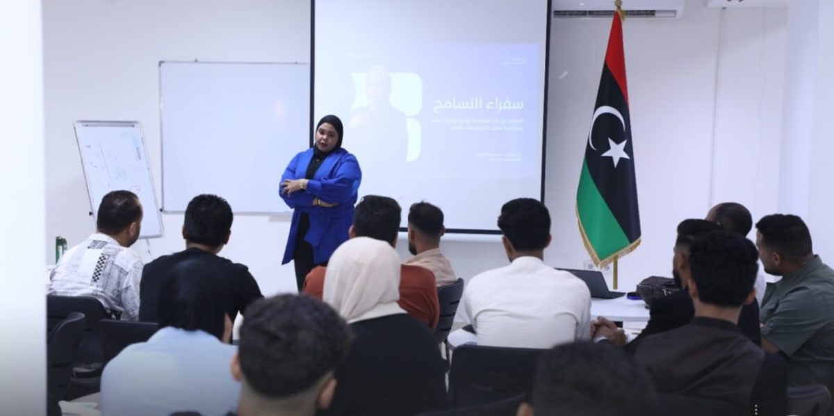 Young Libyan participants gathered in circle during tolerance and dialogue training session in Benghazi