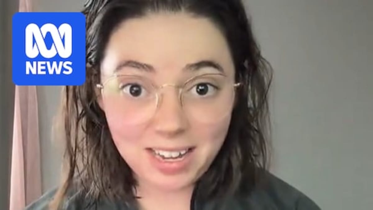 Comedian Laura Johnston smiling at camera in social media video screenshot