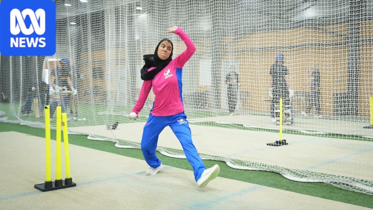 Afghan women's refugee cricket team members celebrating together in cricket uniforms
