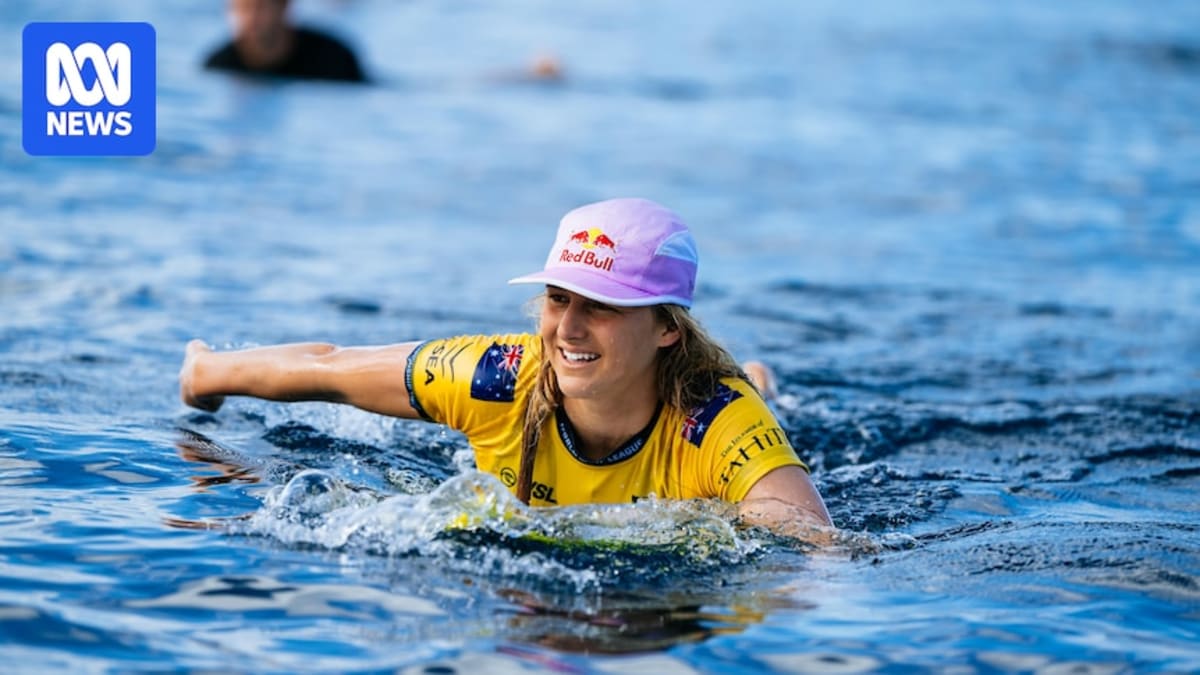 Molly Picklum celebrating with raised arms after winning the 2025 world surfing championship