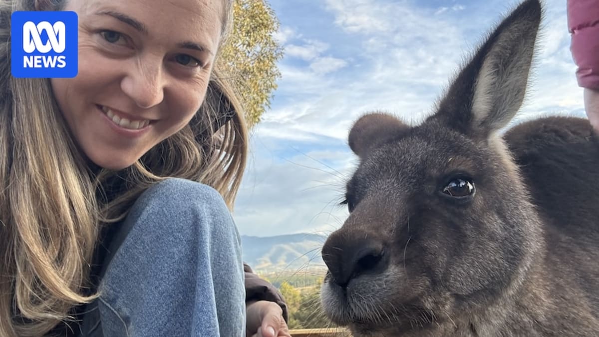 Natalie Jones smiling with her friend Erin, both looking happy and comfortable together