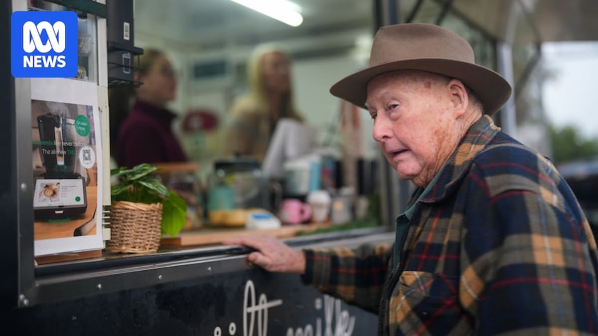 Lee Brown preparing coffee inside her mobile van on the Mallee Highway in rural Australia