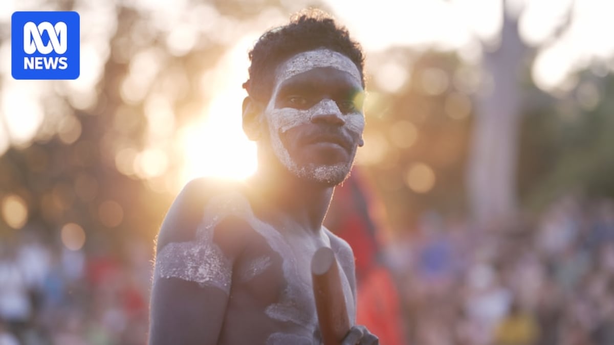 Traditional spear thrower at Barunga Festival preparing to launch spear at distant target