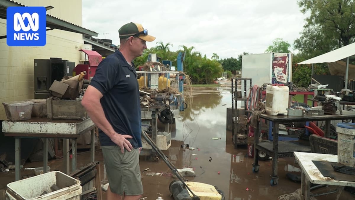 Volunteers helping clean flood-damaged home in Katherine, Australia showing community solidarity after historic flooding