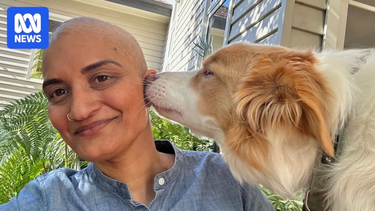 Aarthi Ayyar-Biddle smiling outdoors in garden, demonstrating confidence and body positivity after breast cancer