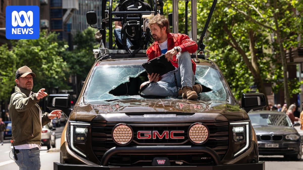 Film crew working with cameras and lighting equipment on a professional movie set