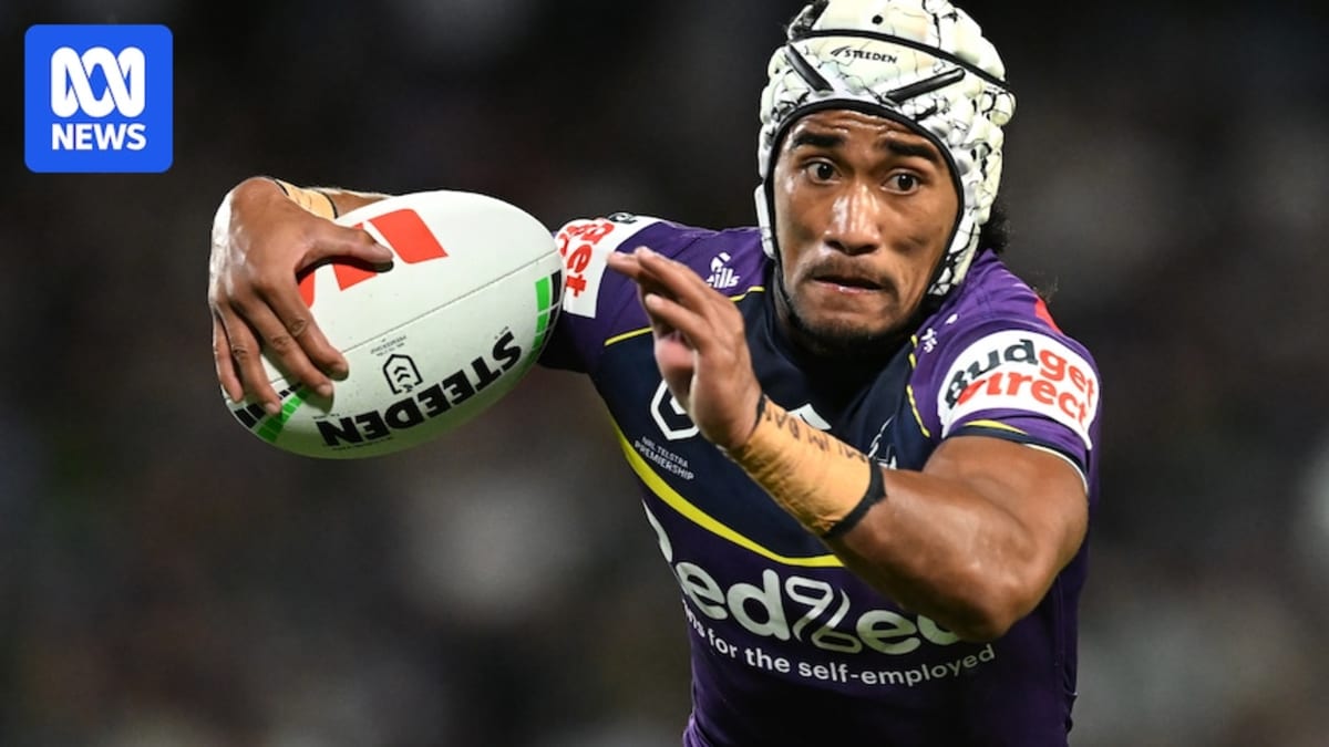 ** Sua Fa'alogo in Melbourne Storm purple jersey running with rugby ball during match