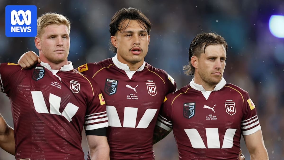 Tino Fa'asuamaleaui in Queensland Maroons jersey with teammates showing support and solidarity