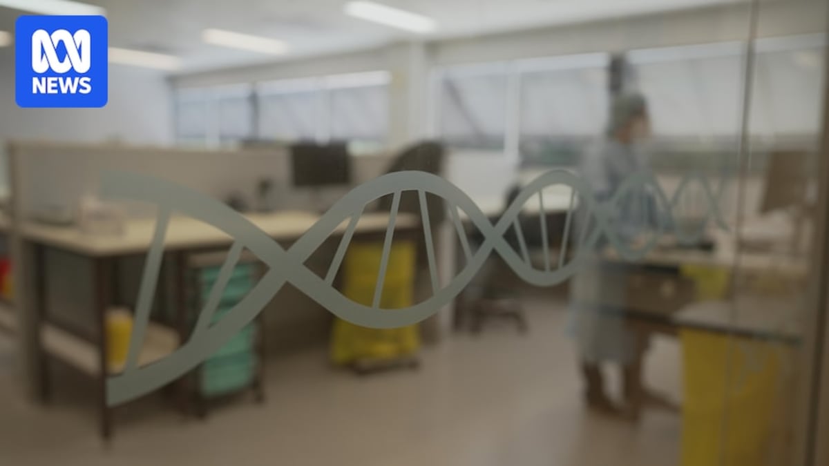 Forensic scientist working with DNA testing equipment in modern laboratory facility