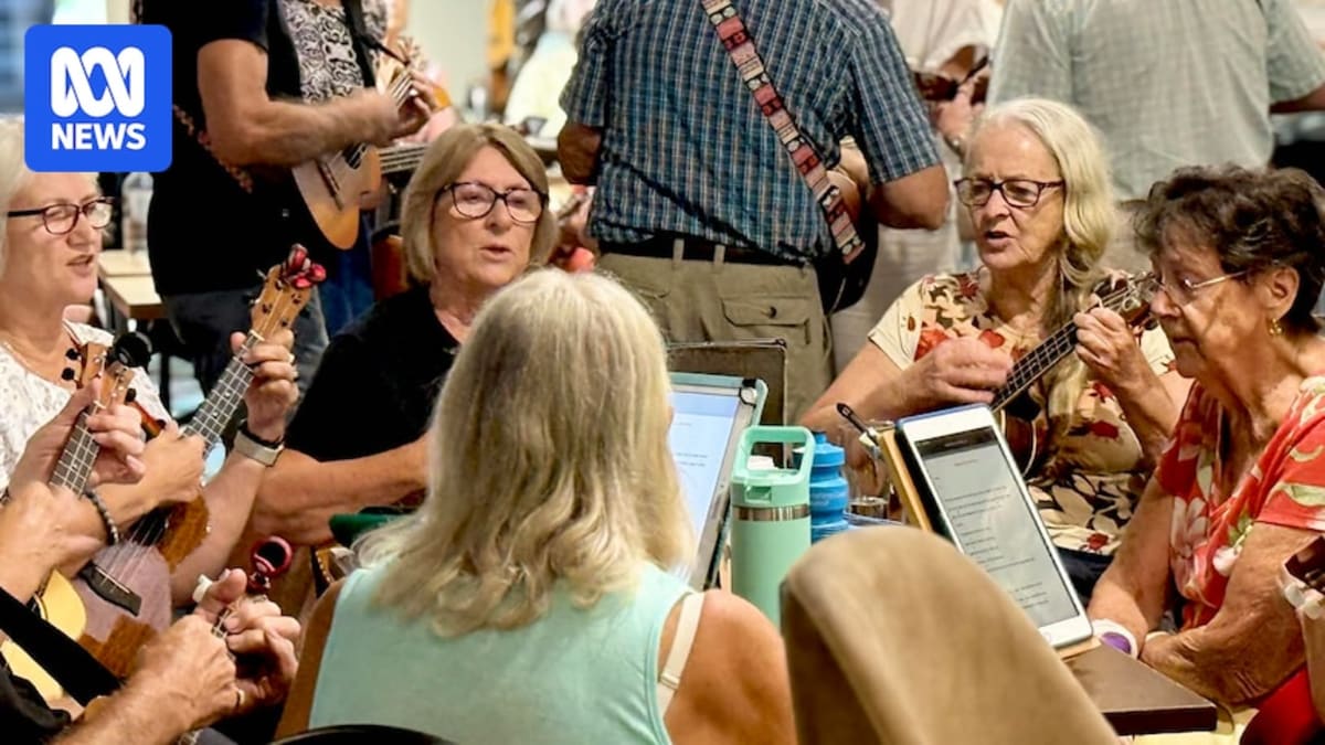 Elderly ukulele players with tablets gathering at RSL club for weekly music session