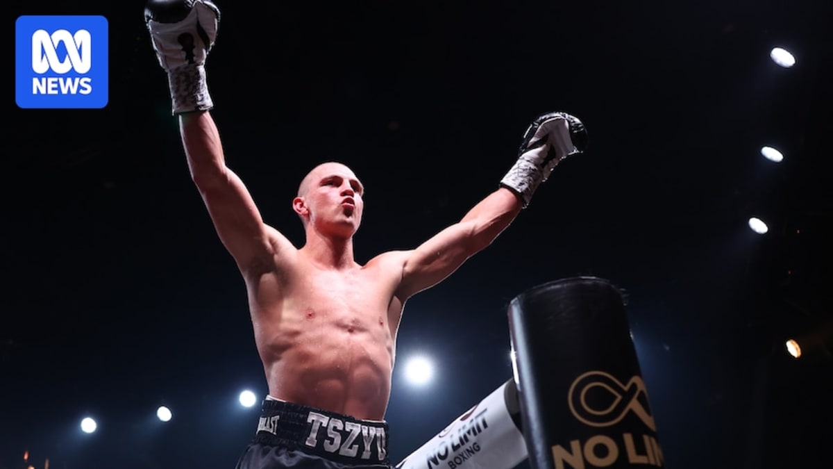 Nikita Tszyu celebrates with raised arms after defeating Oscar Diaz in Newcastle boxing match