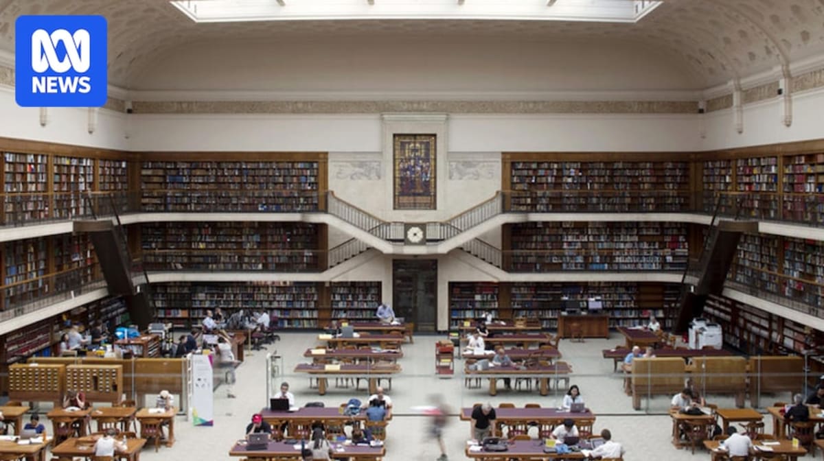 Bright, modern library interior with people reading and studying at welcoming tables