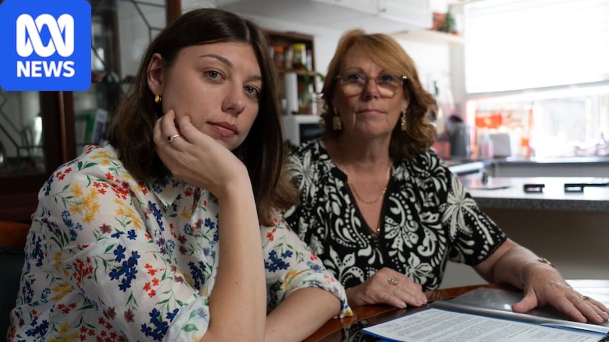 Stephanie Saal holding medical records with her mother Linda, smiling despite difficult journey