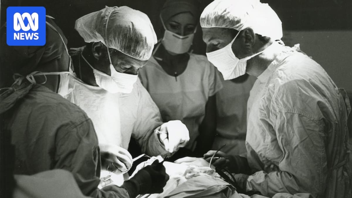 Elderly man John Ross smiling, celebrating 51 years since pioneering heart bypass surgery