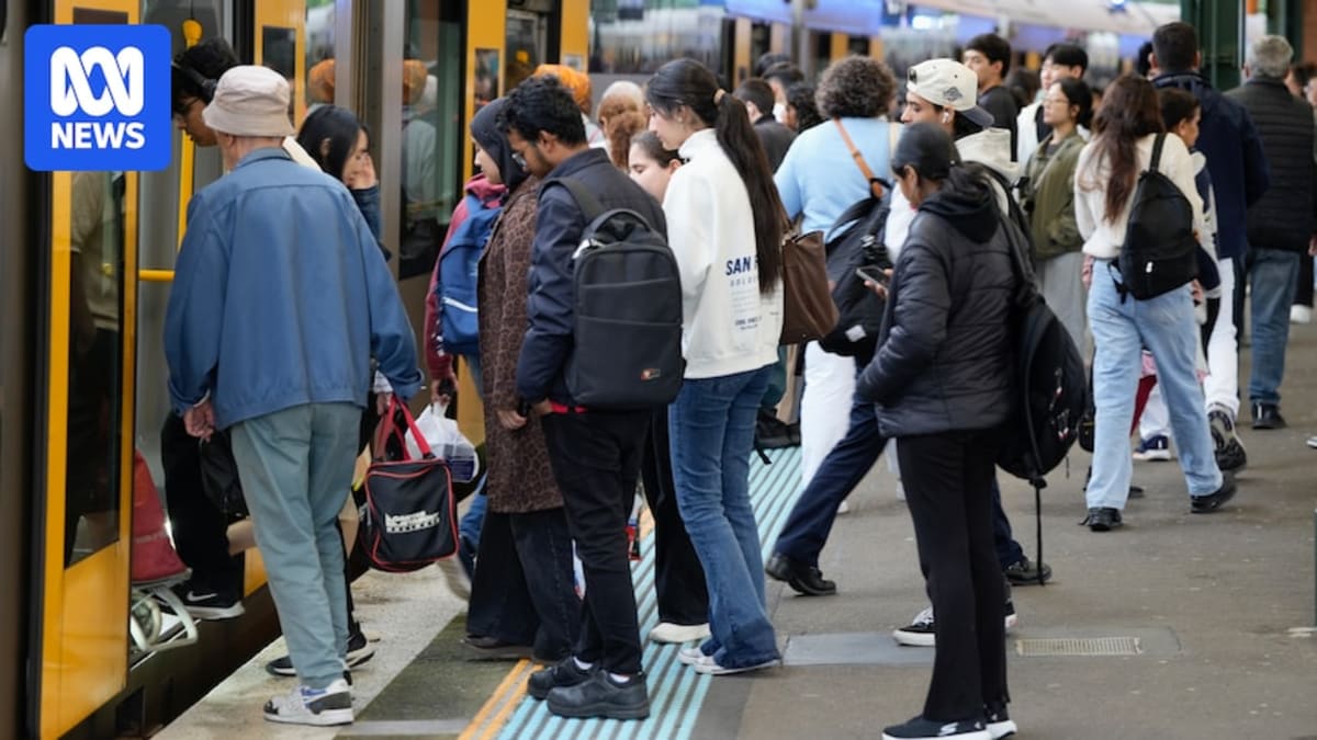 Cyclists and pedestrians traveling on Sydney street with reduced car traffic during fuel crisis