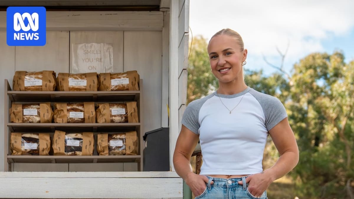 Wooden roadside stall stocked with fresh baked sourdough loaves in Adelaide Hills countryside