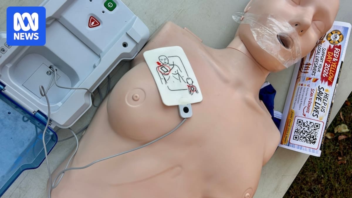 Kieran Lynch stands with CPR training manikins at Yamba Surf Life Saving Club in Australia