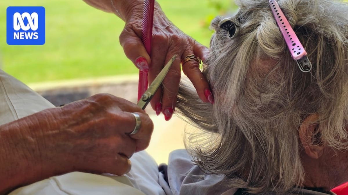 Hairdresser Kelly Wingard smiling while providing compassionate care at Fitzroy Community Hospice