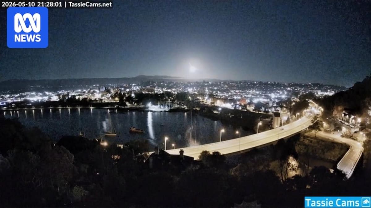Bright green meteor streaking across dark night sky over Launceston Tasmania