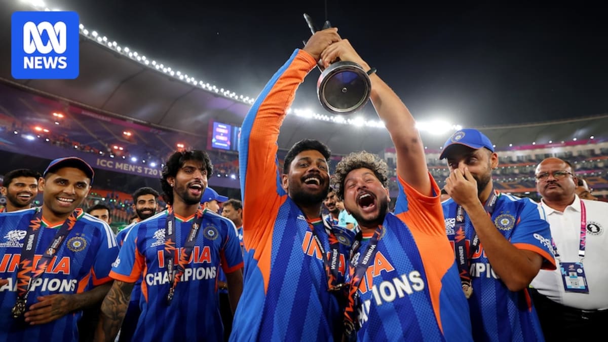Indian cricket players celebrating with trophy after winning T20 World Cup final at packed stadium