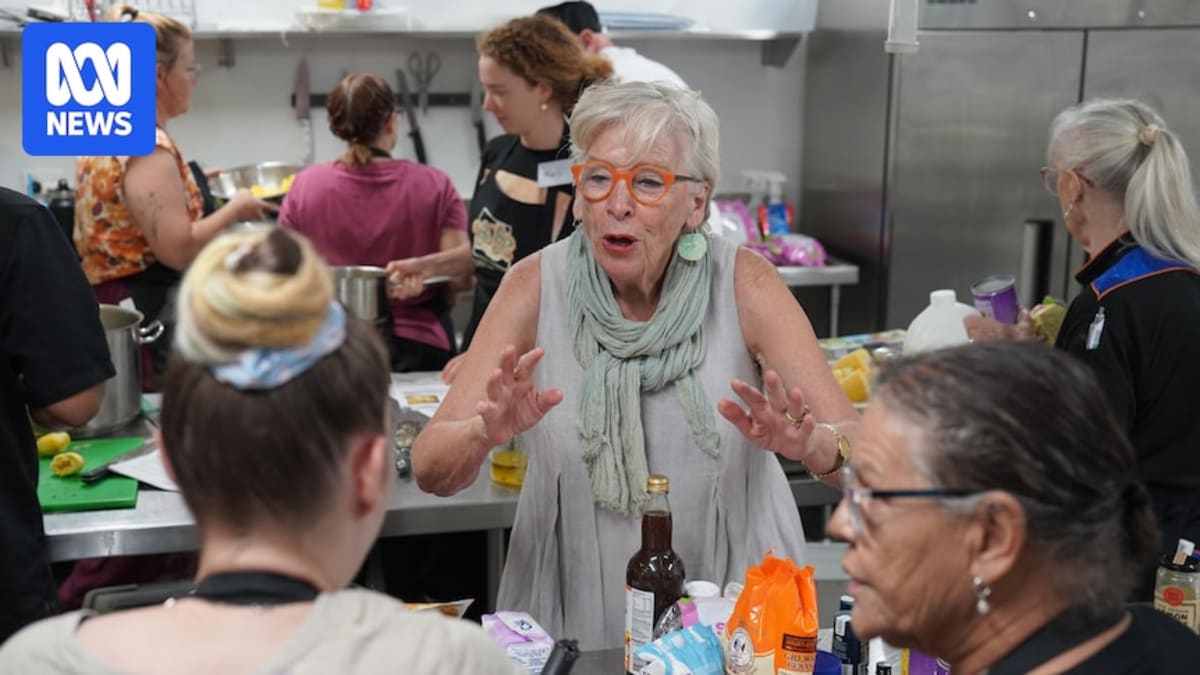 Maggie Beer teaching cooking techniques to Purple House staff in Alice Springs kitchen