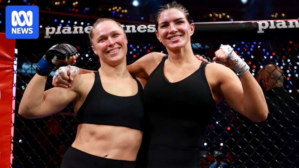 Ronda Rousey and Gina Carano embrace in the cage after their comeback fight in Los Angeles