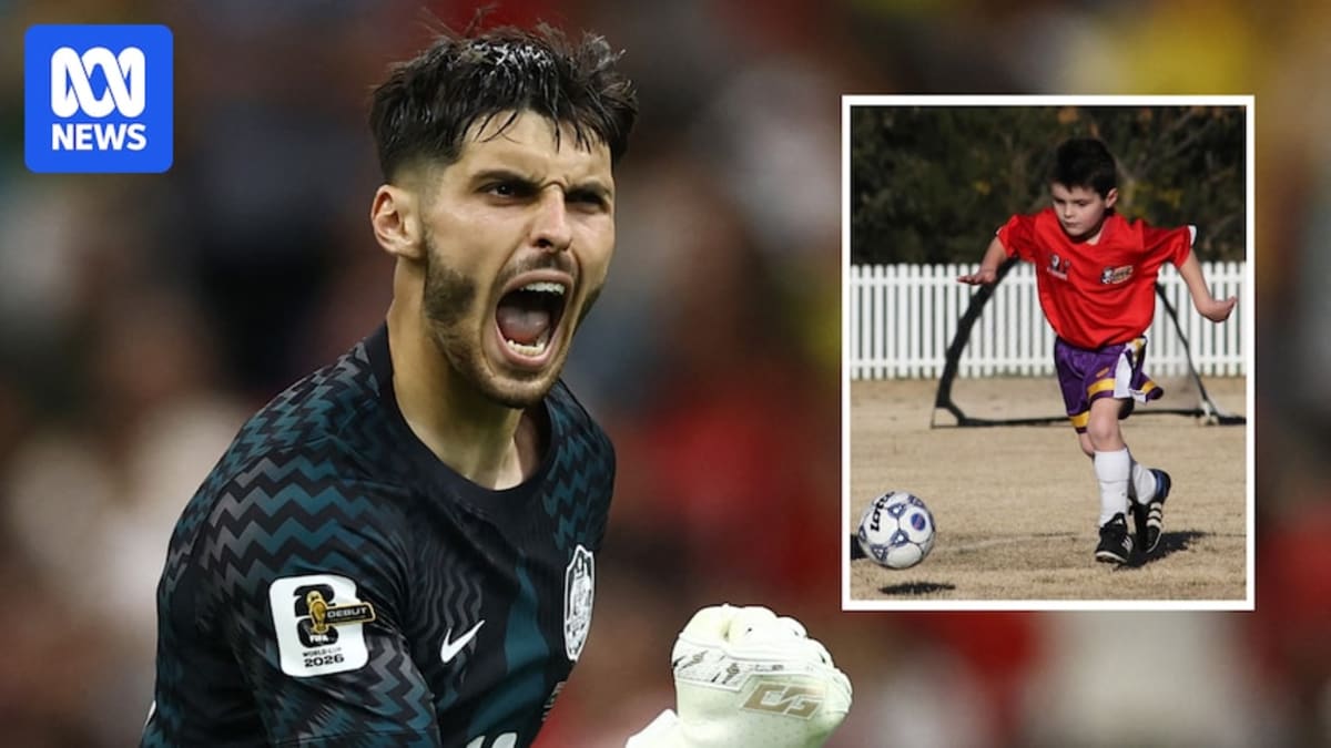 ** Young Australian goalkeeper Patrick Beach making a diving save during World Cup match