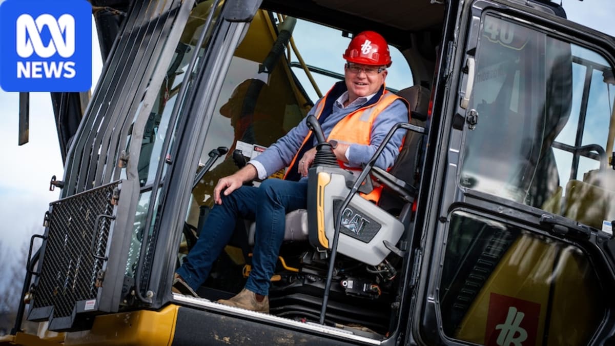 Construction machinery and earthworks beginning at waterfront Macquarie Point stadium site in Hobart Tasmania