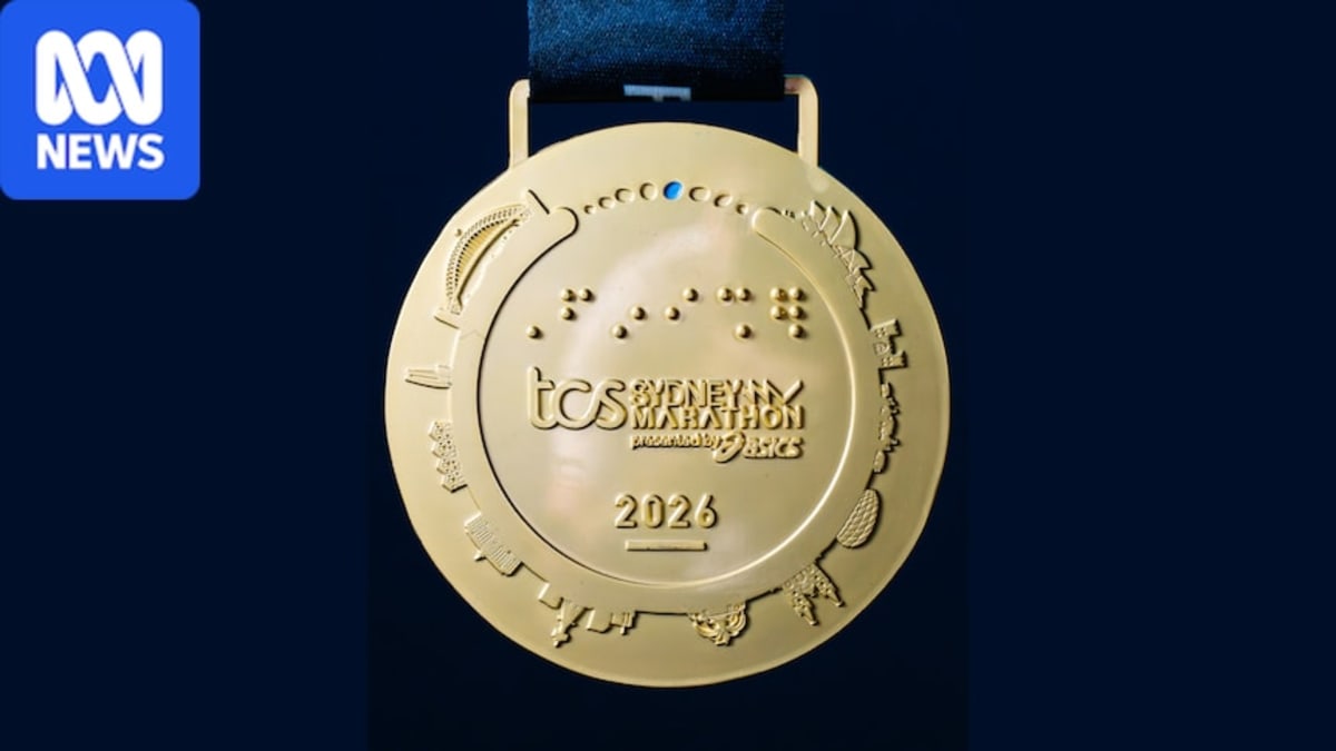 Commemorative medal showing Sydney landmarks with incorrectly featured Munich stadium in corner